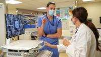 Kristin M. Burkart, MD, MSc, holds a meeting